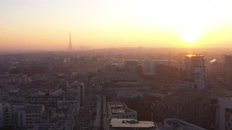 Sunset-over-the-city-of-Paris-aerial-shot-Eiffel-Tower-in-background-France